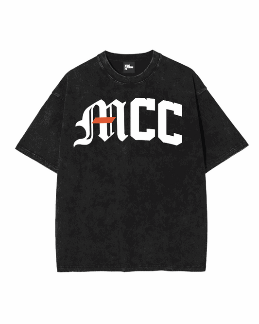 Front view of the MCC Miami Stamped Tee in white, featuring bold arched 'MCC' branding across the chest.